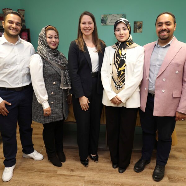 Photo of Education and Early Childhood Development Minister Becky Druhan with four people
